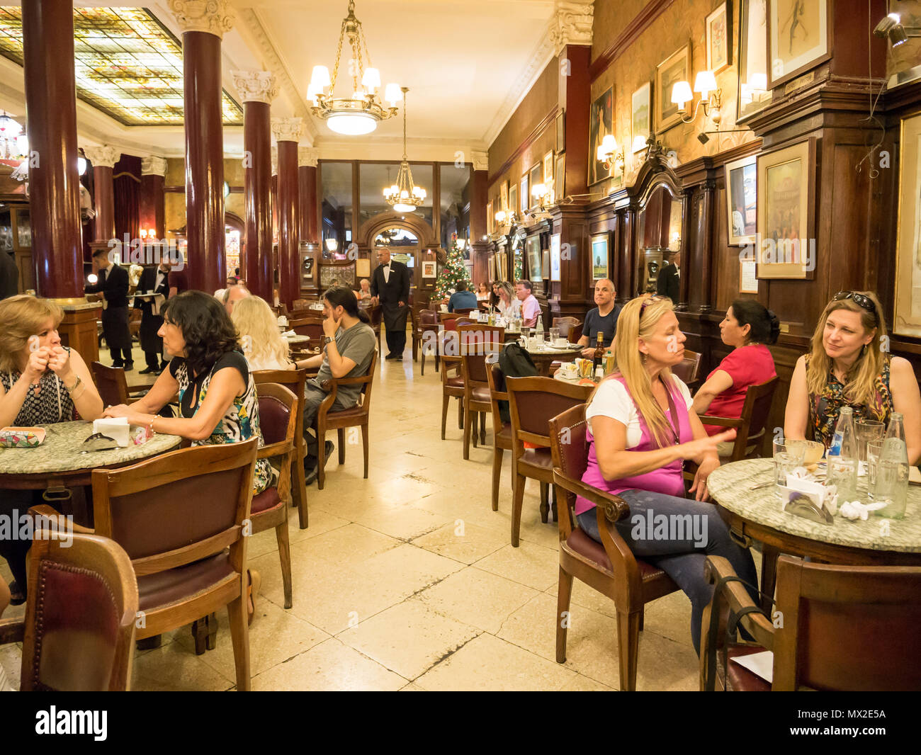 People in cafe Tortoni on Avenida de Mayo in city centre Microcentro in Monserrat district in capital Buenos Aires, Argentina Stock Photo