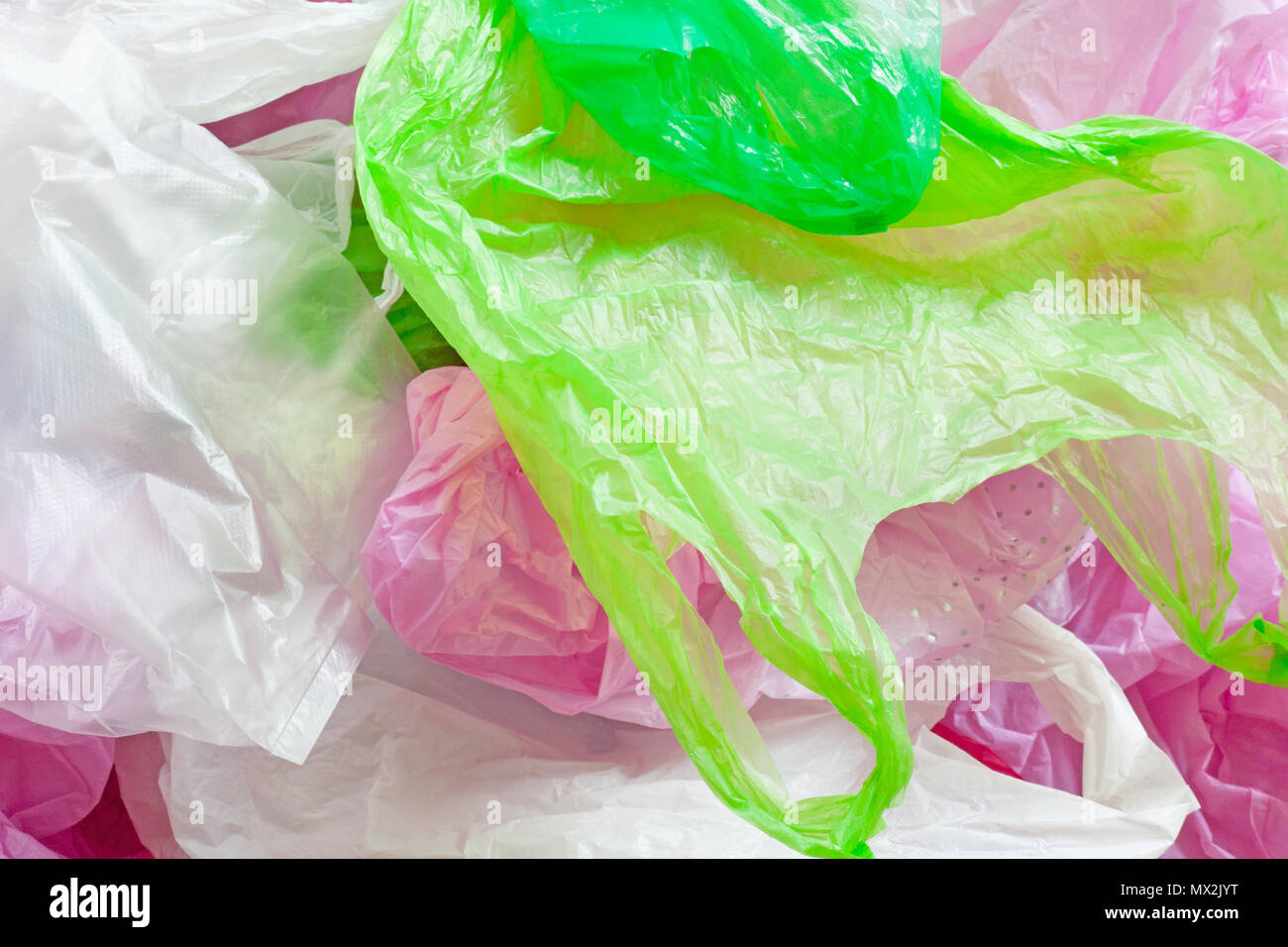 Colorful plastic bag on cement floor background. Stock Photo