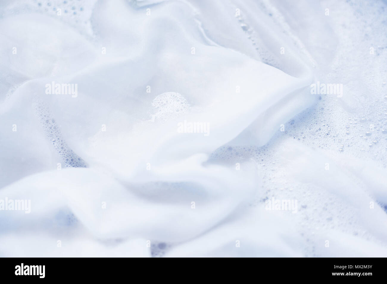 Soak a cloth before washing, white clothes Stock Photo Alamy
