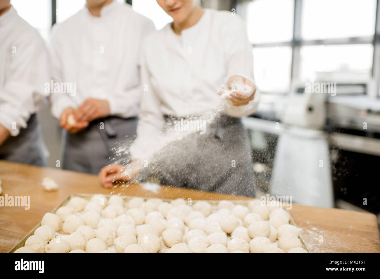 Bakers making buns at the manufacturing Stock Photo