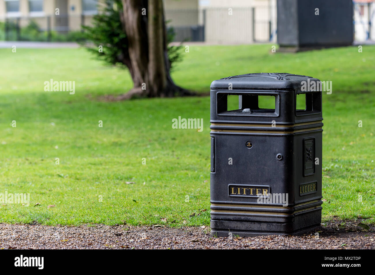 Black litter bin with gold trim, the word Litter on the front, and with
