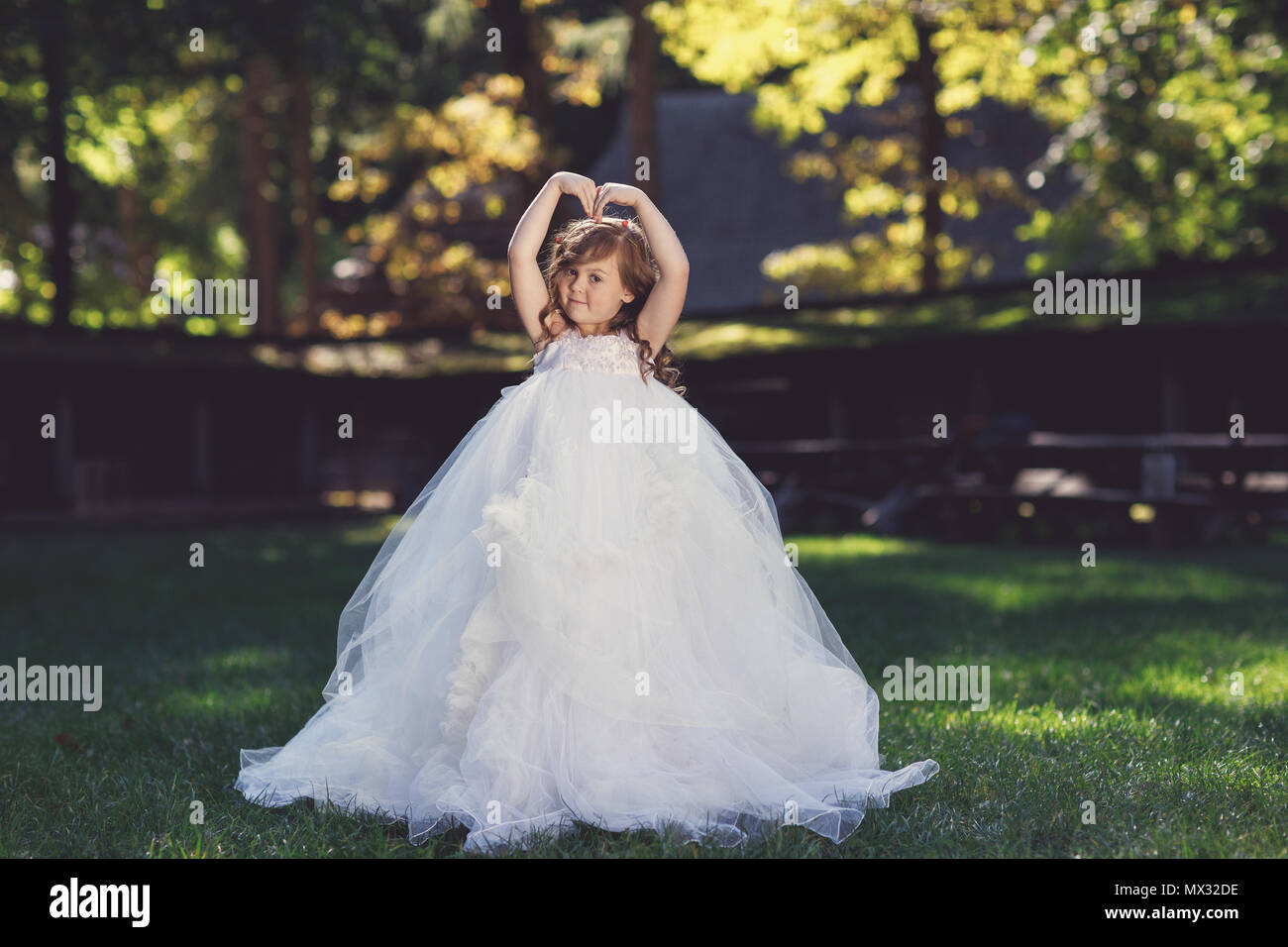 Outdoor portrait of adorable smiling little girl in white dress Stock ...
