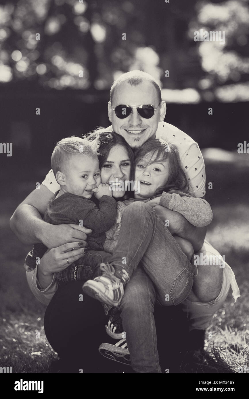 happy Family with children playing in park Stock Photo - Alamy