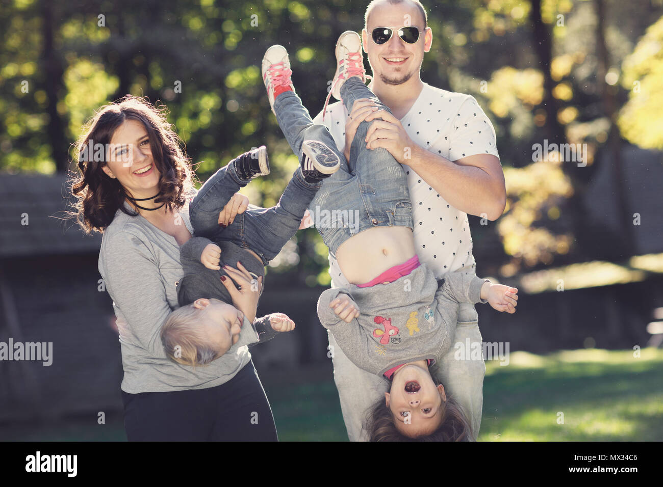 happy Family with children playing in park Stock Photo