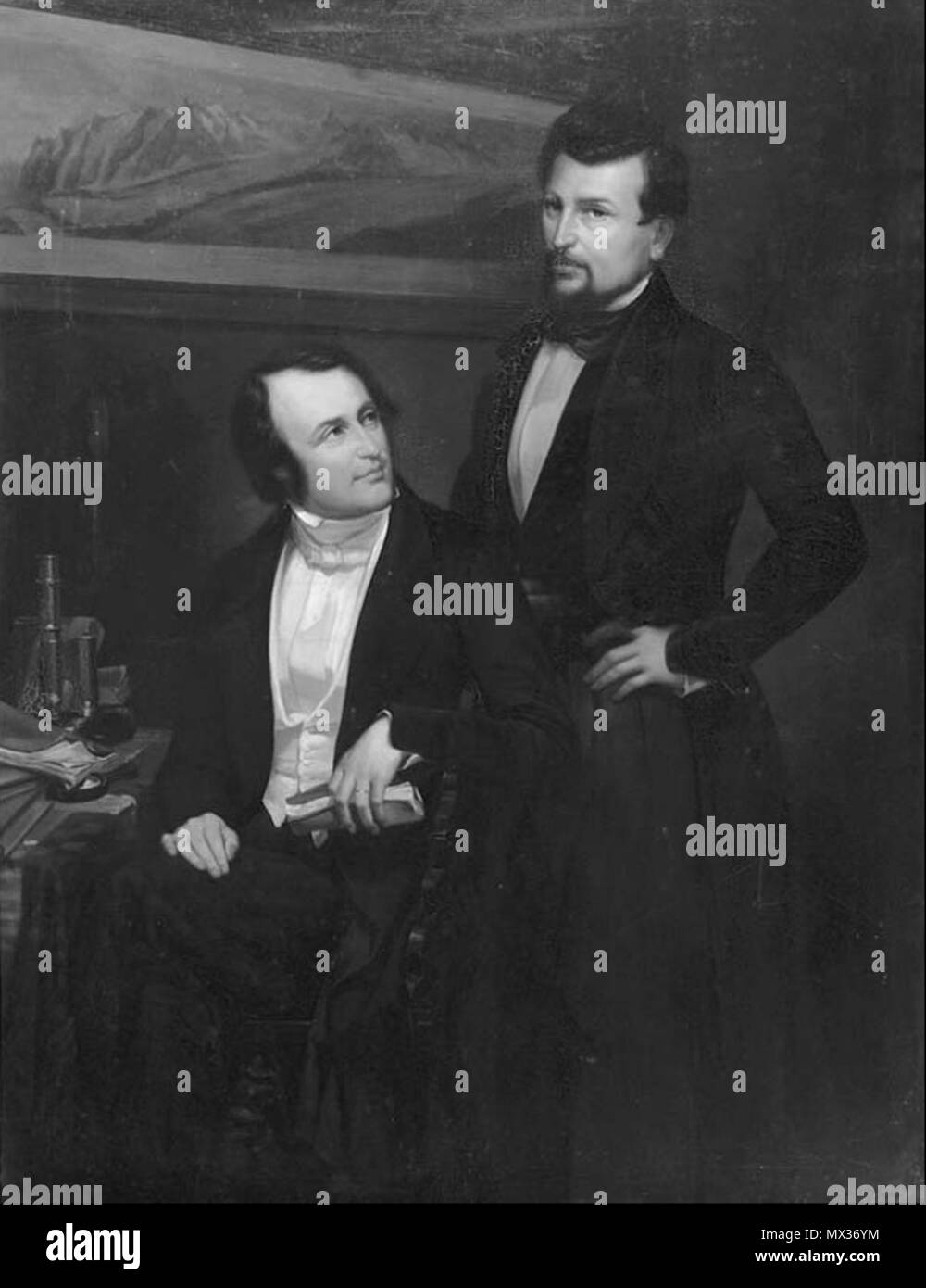 . English: Black-and-white reproduction of an oil painting showing Louis Agassiz (seated) and Pierre Jean Édouard Desor (standing). In the background on the wall the painter shows Jacques Bourkhardt's (1811–1867) painting Panorama de la mer de glace du Lauteraar et du Finsteraar–Hôtel des Neuchâtelois, 1842. The original of Berthoud's painting is at the Musée d’Art et d’Histoire Neuchâtel, Switzerland (Inventory no. 762). 19th century. Fritz Berthoud (1812–1890) 29 Agassiz and Desor by Berthoud Stock Photo