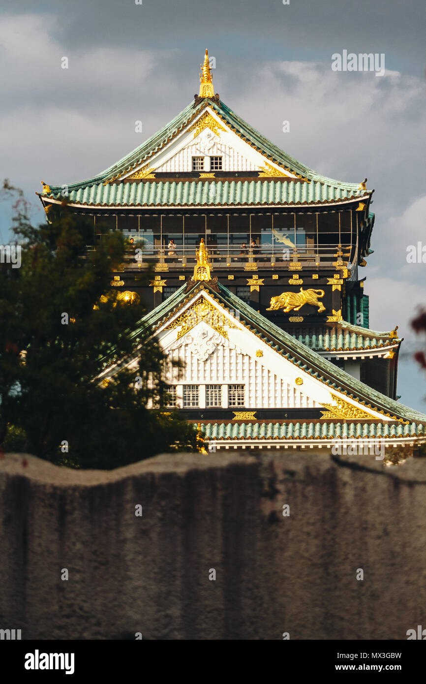 Osaka Castle is a Japanese castle in Chūō-ku, Osaka, Japan. The main tower of Osaka Castle is situated on a plot of land roughly one square kilometer. Stock Photo