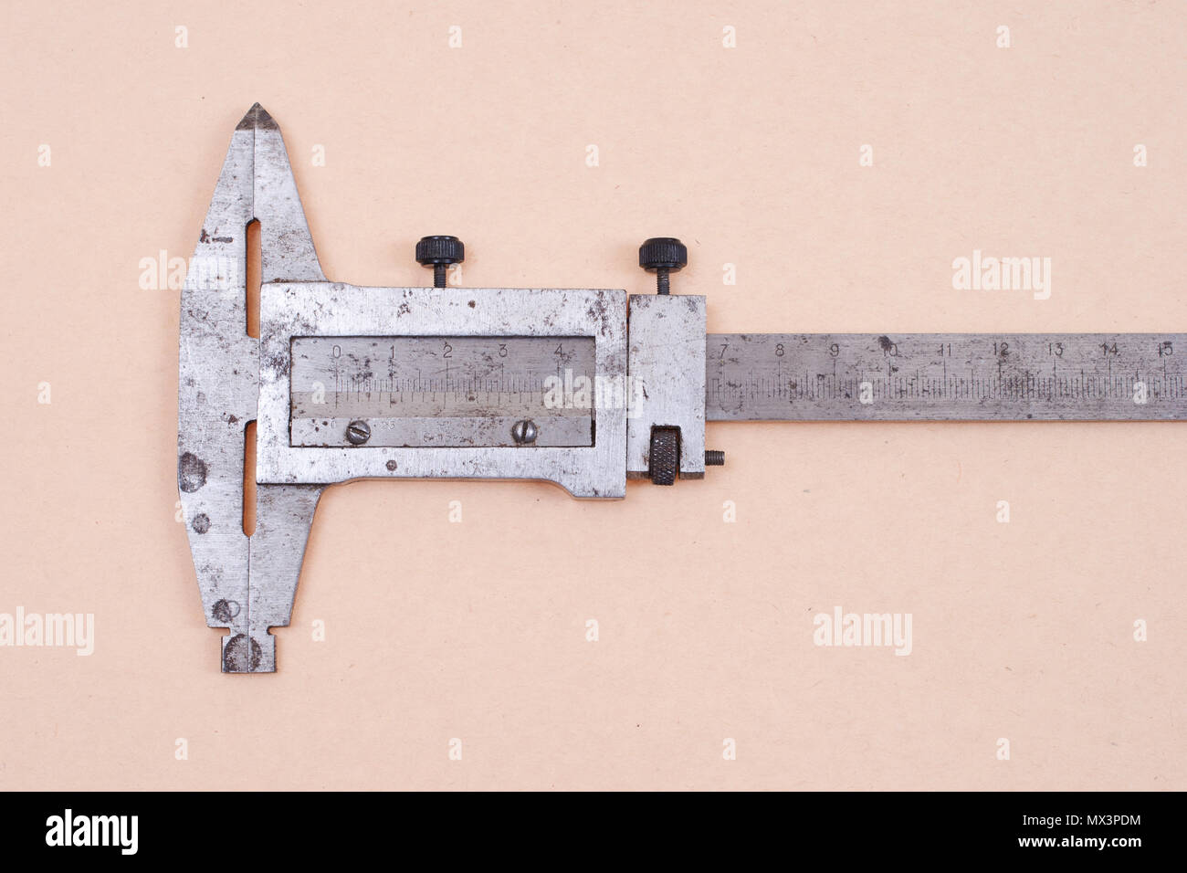 Vernier calipers isolated on old paper background Stock Photo Alamy