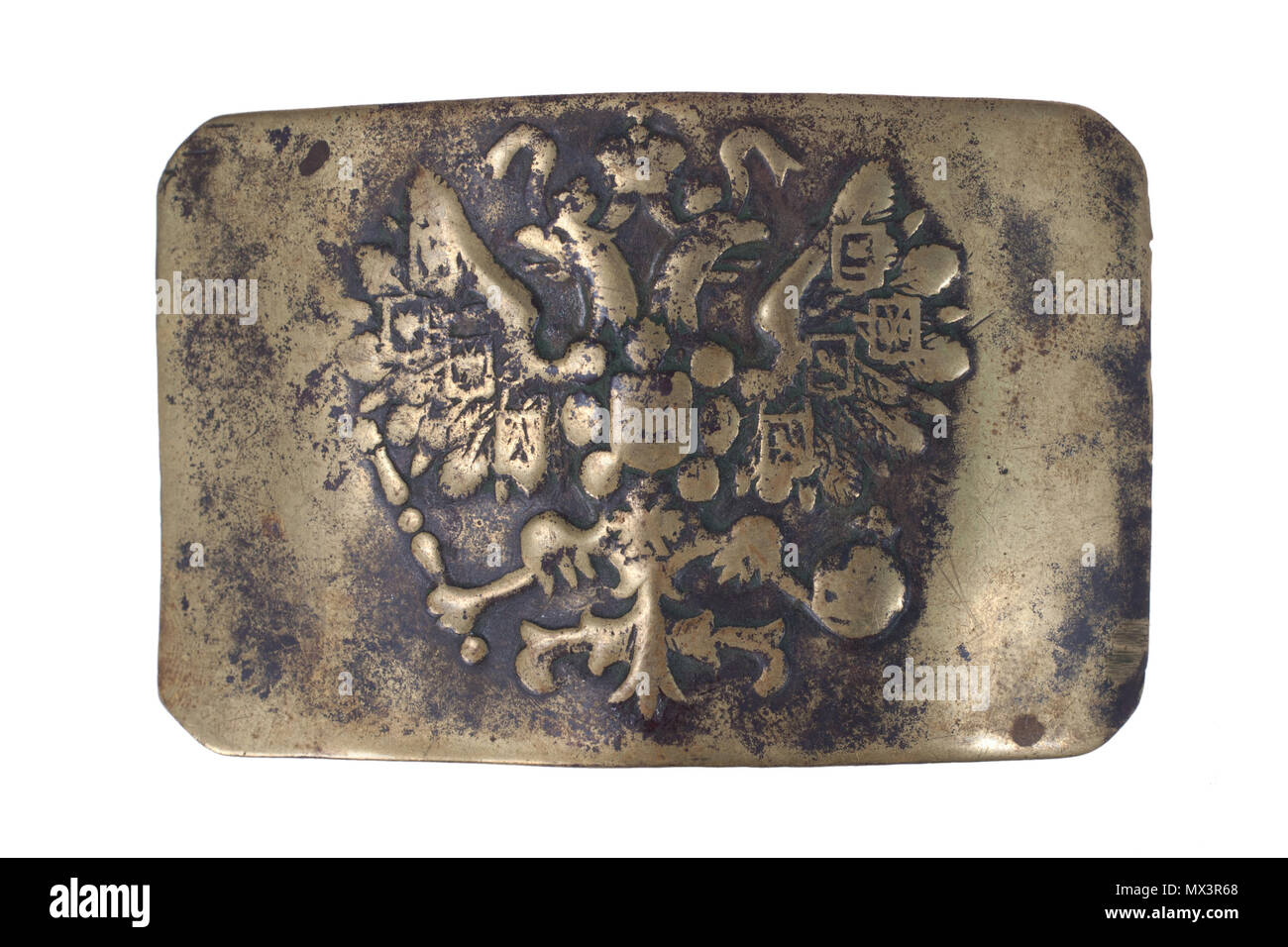 Old vintage buckle from Russian Empire Army uniform isolated on a white background Stock Photo