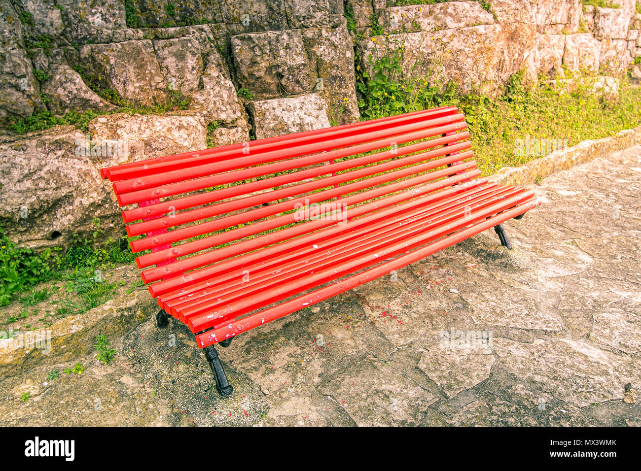 empty red wooden bench in peniche portugal stock photo 188170771