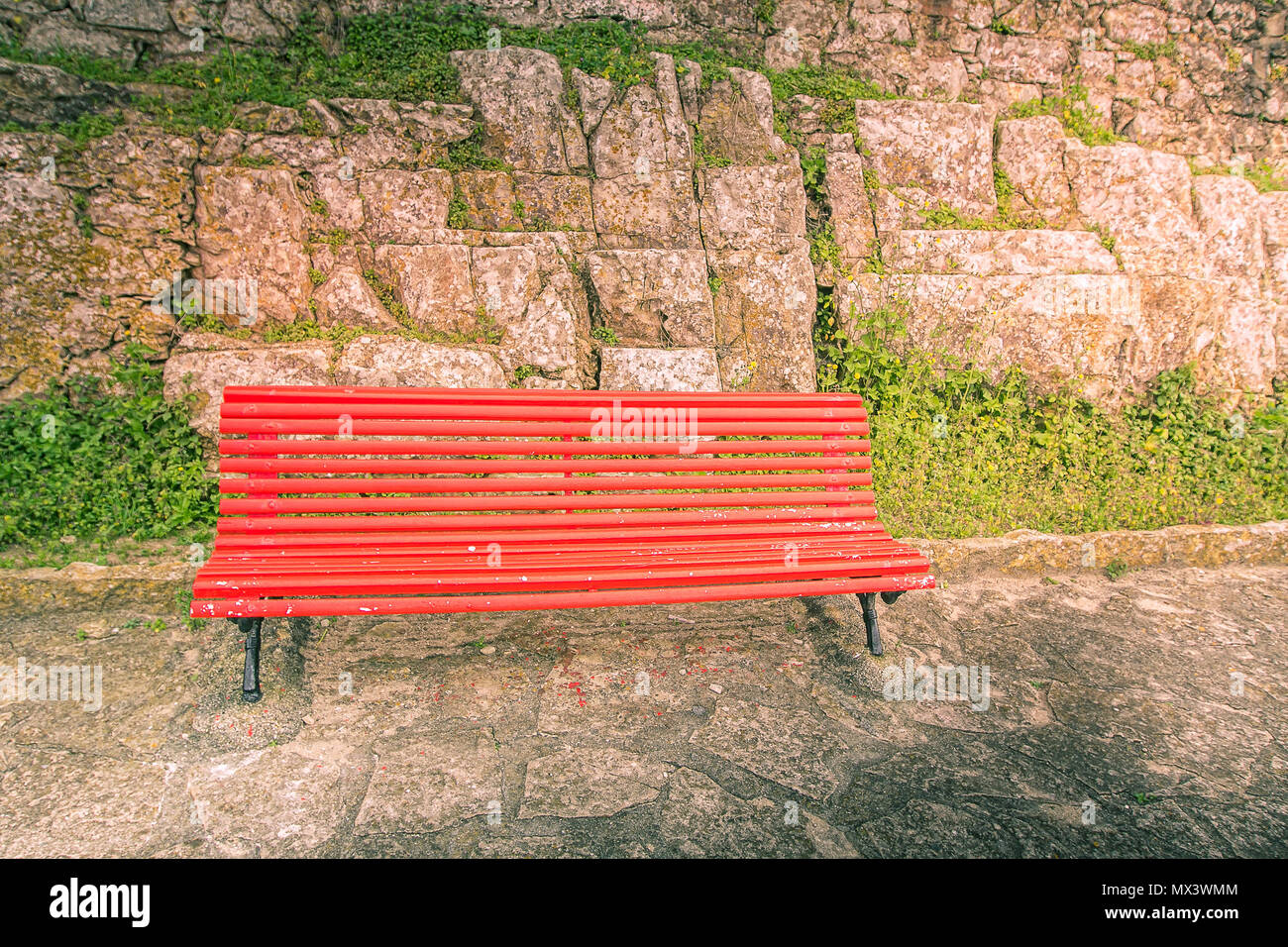 empty red wooden bench in peniche portugal stock photo 188170772