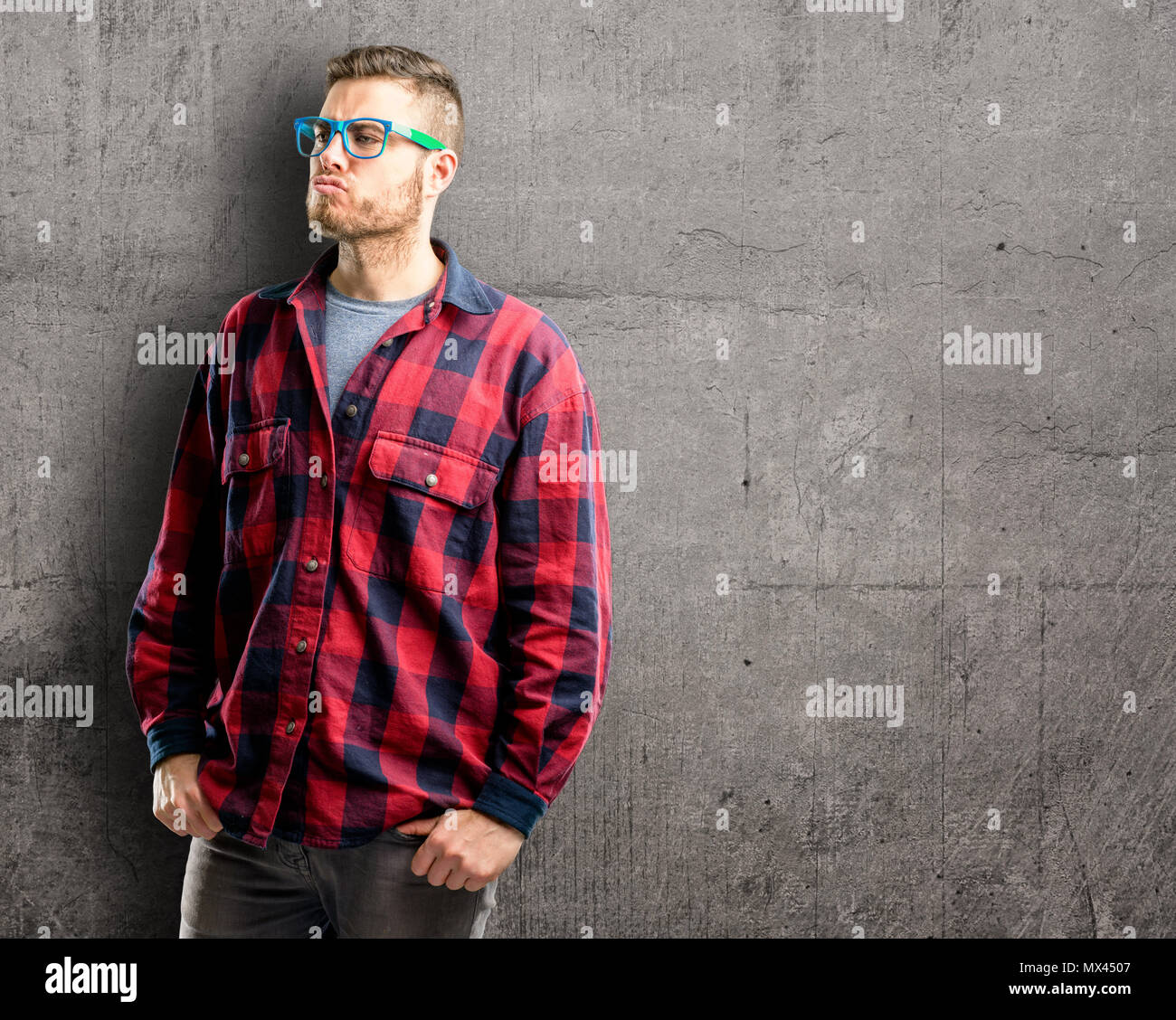 Young handsome man expressing love, blows kiss at camera, flirting Stock Photo