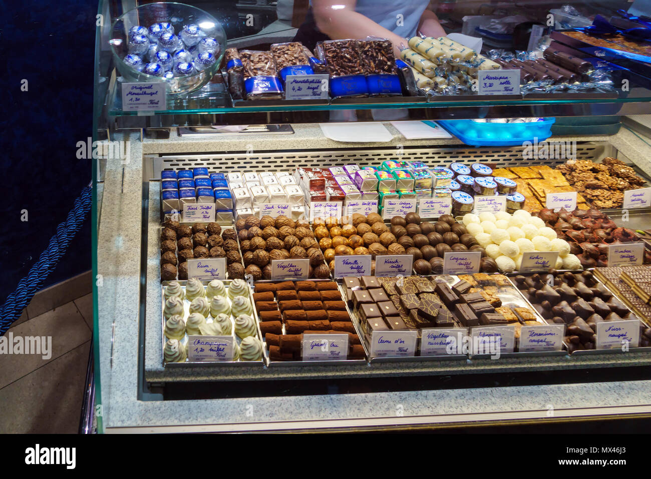 Salzburg, Austria - October 21, 2017: Showcase of the famous confectionery store Furst, the inventor of Mozart sweets, where tourists buy chocolate se Stock Photo