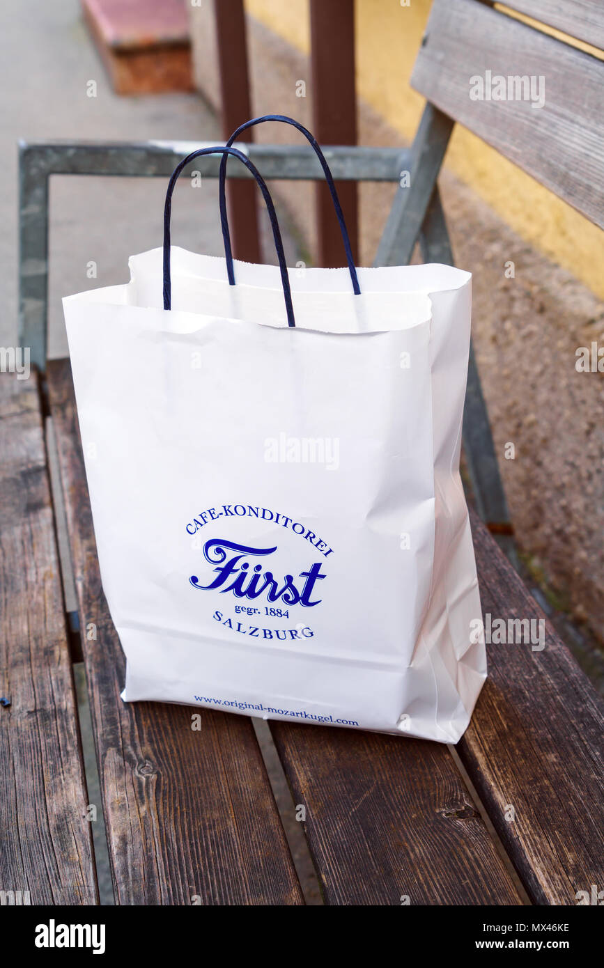 Salzburg, Austria - October 21, 2017: Bag of the famous confectionery store Furst, the inventor of Mozart sweets, where tourists buy chocolate sets as Stock Photo