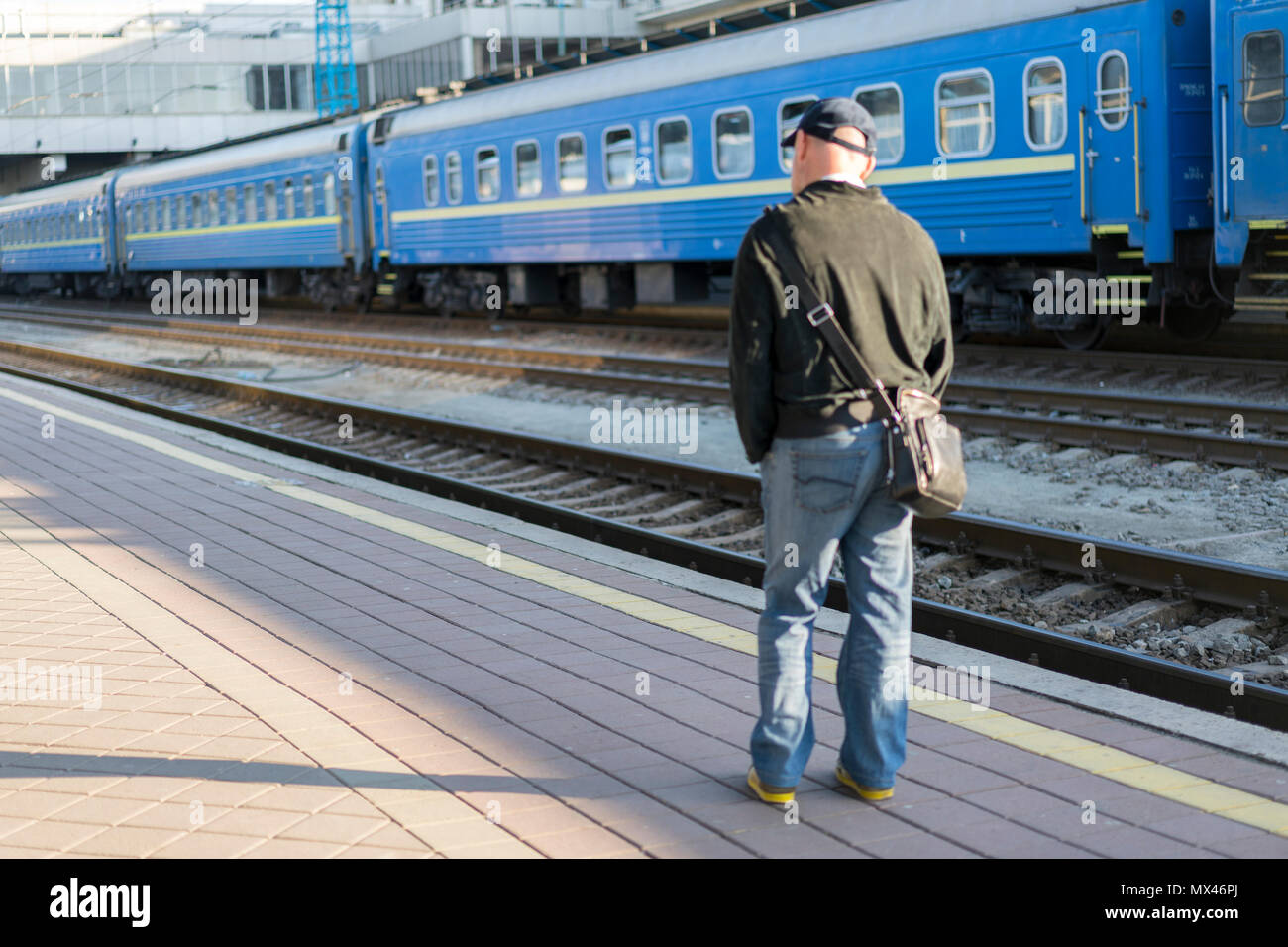 Handsome man waiting train hi-res stock photography and images - Alamy