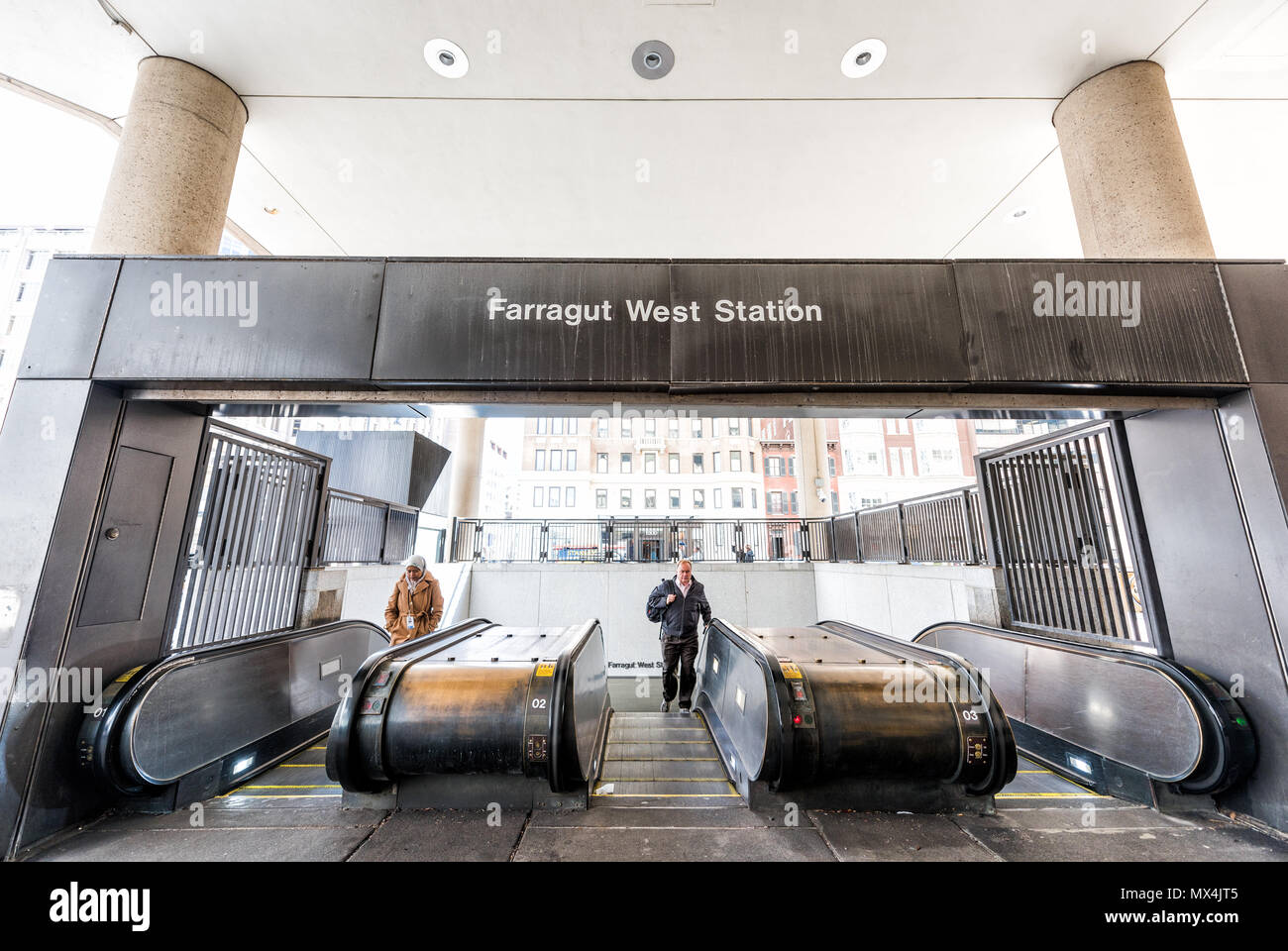 Washington DC, USA March 9, 2018 Farragut West Station Metro Subway street sign, people on
