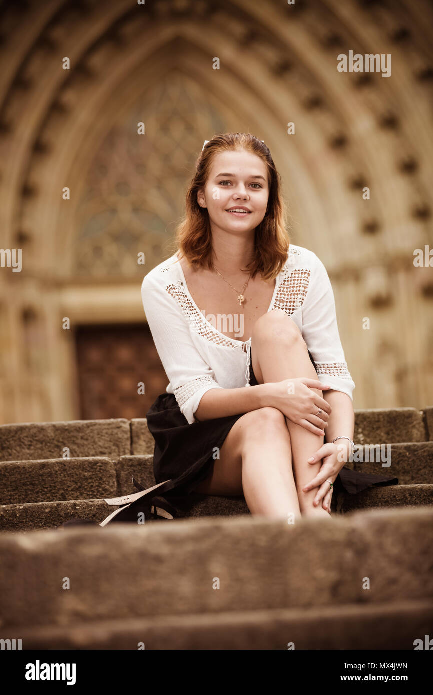 Woman sitting barefoot on steps hi-res stock photography and images - Alamy
