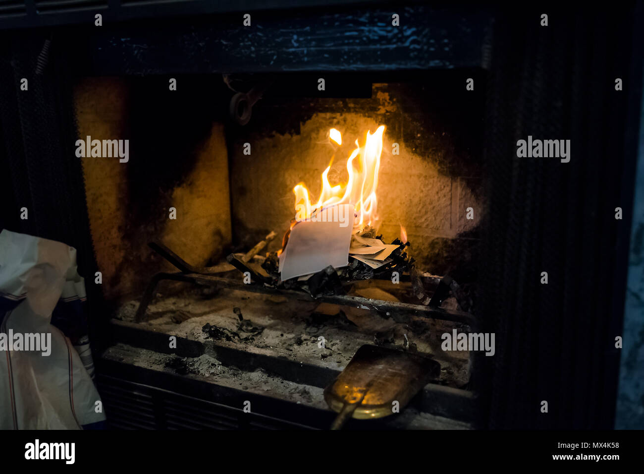 Burning Paper Letters In Indoor Home Interior Fireplace With Old