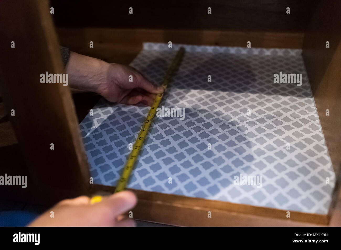Man Hands Placing Protective Adhesive Liner Sheet Yellow