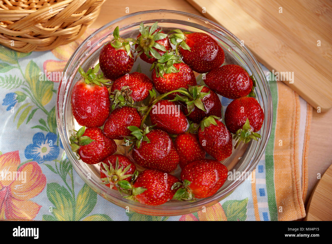 Fresh strawberry in capacity with water Stock Photo