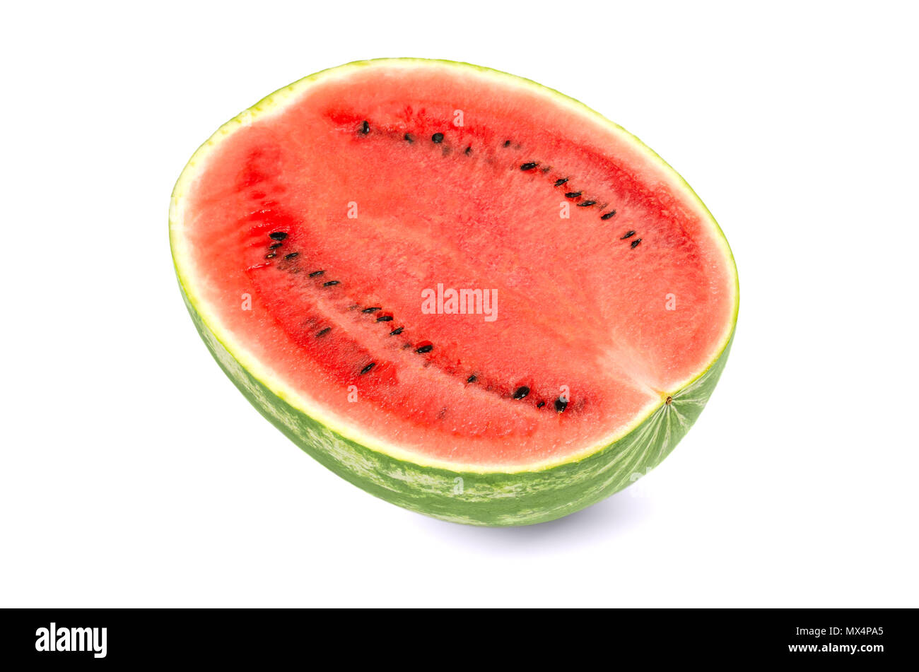Sweet watermelon half, front view, on white background. Large ripe fruit of Citrullus lanatus with green striped skin, red pulp and black seeds. Stock Photo