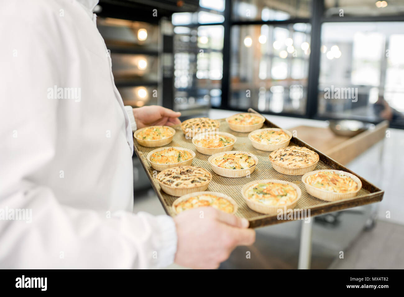 Holding tray with freshly baked buns Stock Photo