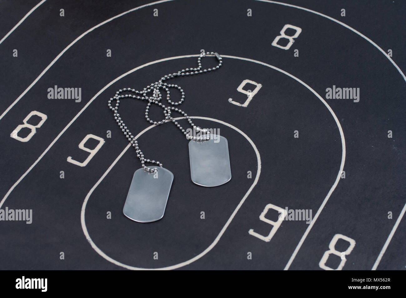 Black target with blank dog tags Stock Photo Alamy