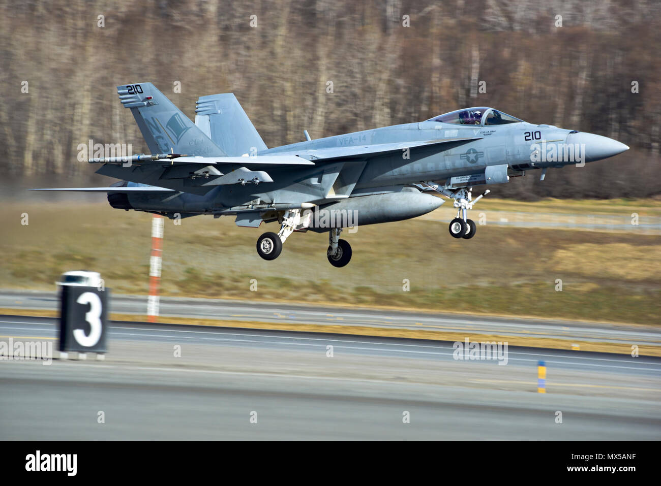 JOINT BASE ELMENDORF-RICHARDSON, Alaska - A U.S. Navy F/A-18E Super Hornet takes off for a training mission May 3, 2017. Northern Edge 2017 is Alaska's premiere joint training exercise designed to practice operations, techniques, and procedures as well as enhance interoperability among the services. Thousands of participants from all the services; Airmen, Soldiers, Sailors, Marines, and Coast Guard personnel from active duty, Reserve and National Guard units, are involved. Stock Photo