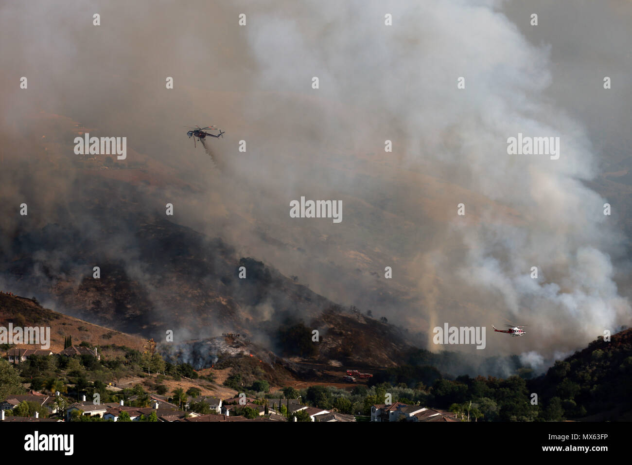 Aliso Viejo, California, USA. 2nd June, 2018. Helicopter drops water as