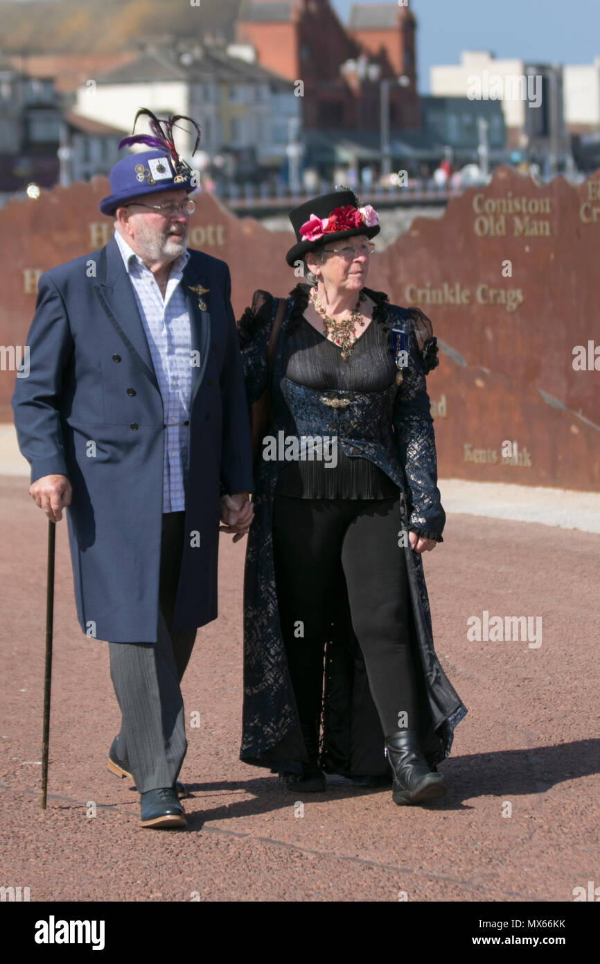 A couple take a Vintage Victorian Stroll in Morecambe, Lancashire, UK. Jun, 2018.  A Splendid Day Out, a full weekend of Steampunk entertainments in the charming Victorian seaside retreat of Morecambe. Credit:MediaWorldImages/AlamyNews Stock Photo