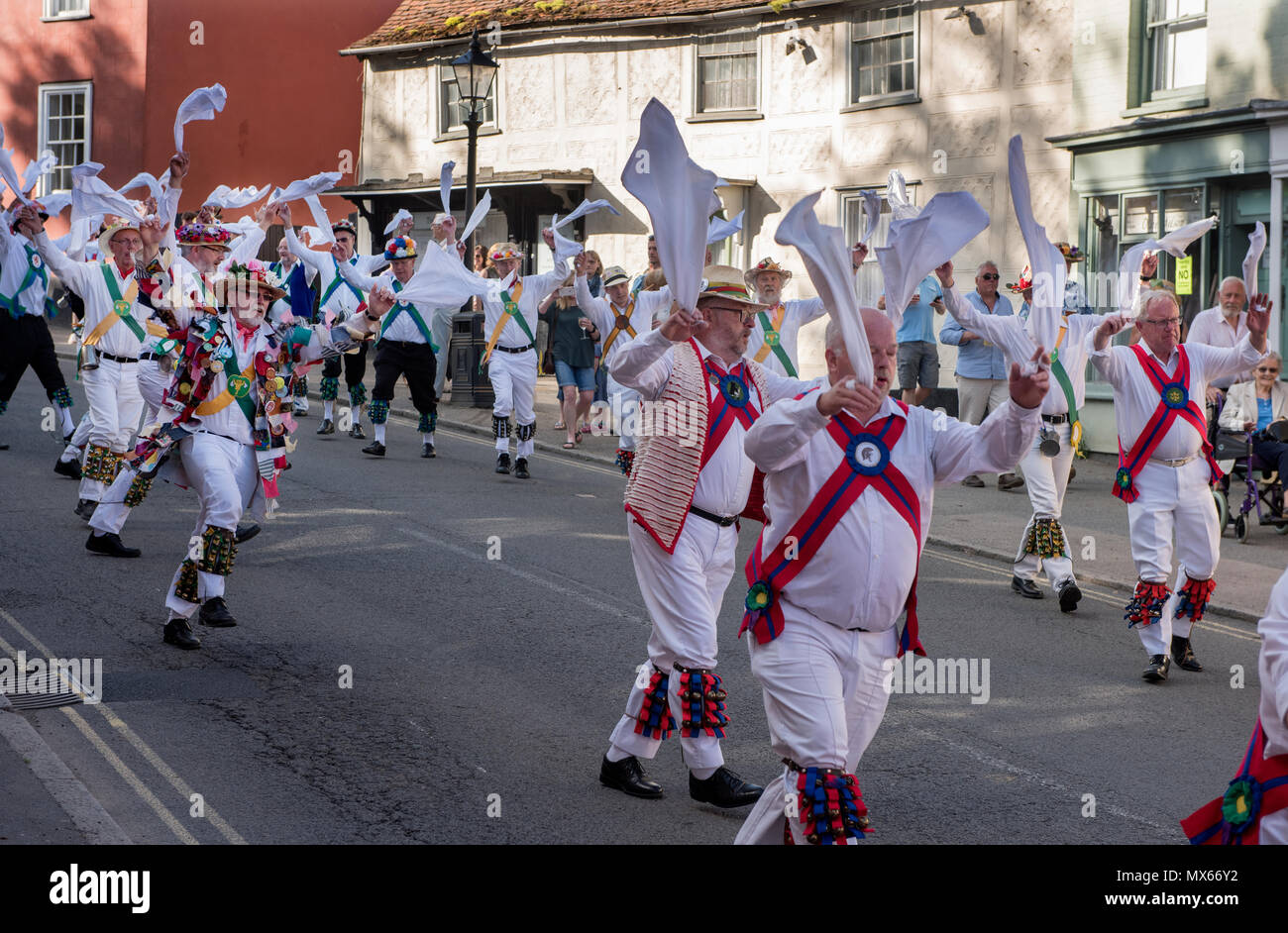 Thaxted Morris Weekend, Thaxted Essex England UK. 2-3 June 2018 The 85th Meeting of the Member Clubs of the Morris Ring hosted by Thaxted Morris Men (who wear red and white stripes) who lead the Saturday evening procession to Town Street in Thaxted after a busy day of dancing in a dozen local pubs in surrounding villages in North West Essex. Credit: BRIAN HARRIS/Alamy Live News Stock Photo