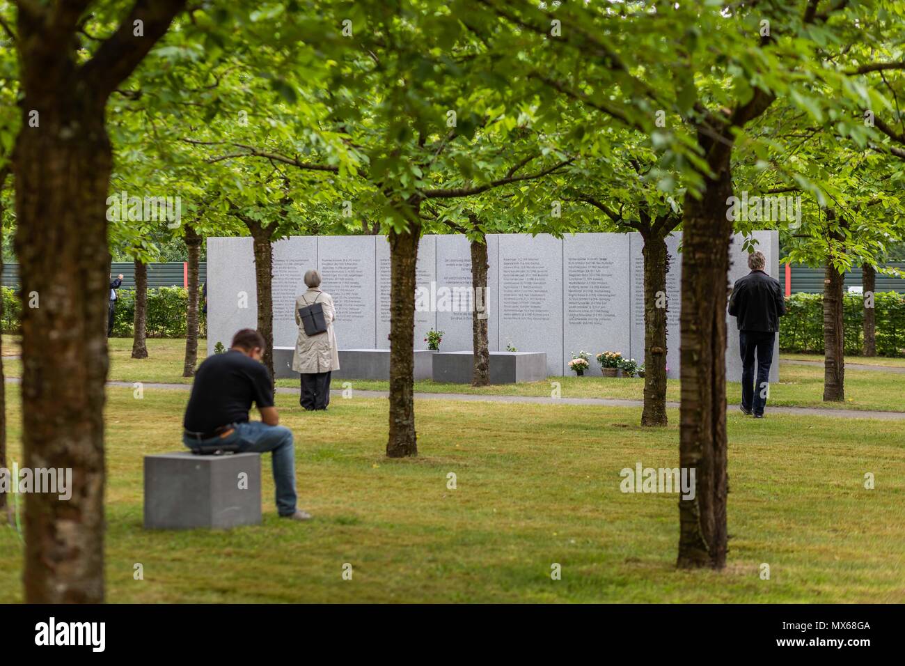 Eschede, Germany. 03 May 2018, Germany, Eschede: Visitors commemorating the victims of the train accident in Eschede for the 20th anniversary of the accident. The ICE 'Wilhelm Conrad Roentgen' derailed on the 3 June 1998 at tempo 200 and drove into a highway bridge. 101 people died. Photo: Philipp von Ditfurth/dpa Stock Photo