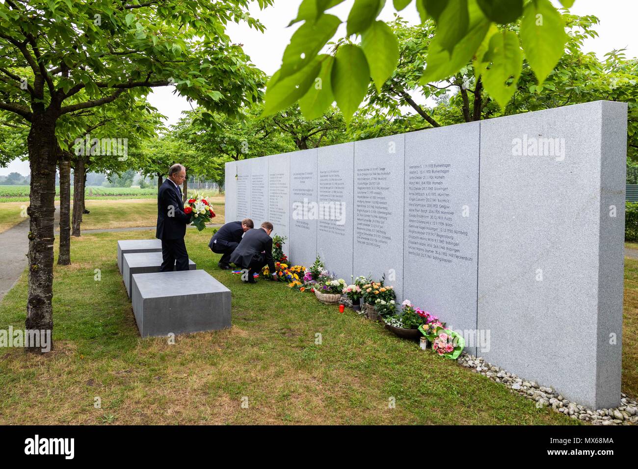 Eschede, Germany. 03 May 2018, Germany, Eschede: The Parliamentary State Secretary from the Christian Democratic Union (CDU), Enak Ferlemann (L-R), Chairman of the Deutsche Bahn, Richard Lutz, and the Premier of Lower Saxony from the Social Democratic Party (SPD), Stephan Weil, commemorating the victims of the train accident in Eschede for the 20th anniversary of the accident. The ICE 'Wilhelm Conrad Roentgen' derailed on the 3 June 1998 at tempo 200 and drove into a highway bridge. 101 people died. Photo: Philipp von Ditfurth/dpa Stock Photo