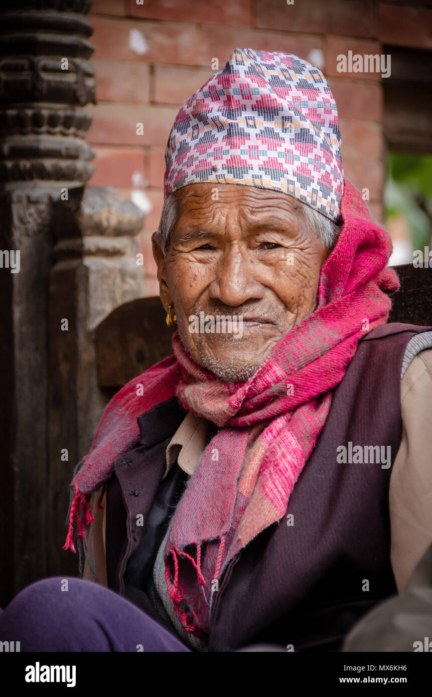 Elder man wearing traditional Dhaka Topi headwear from Bhaktapur, Nepal Stock Photo