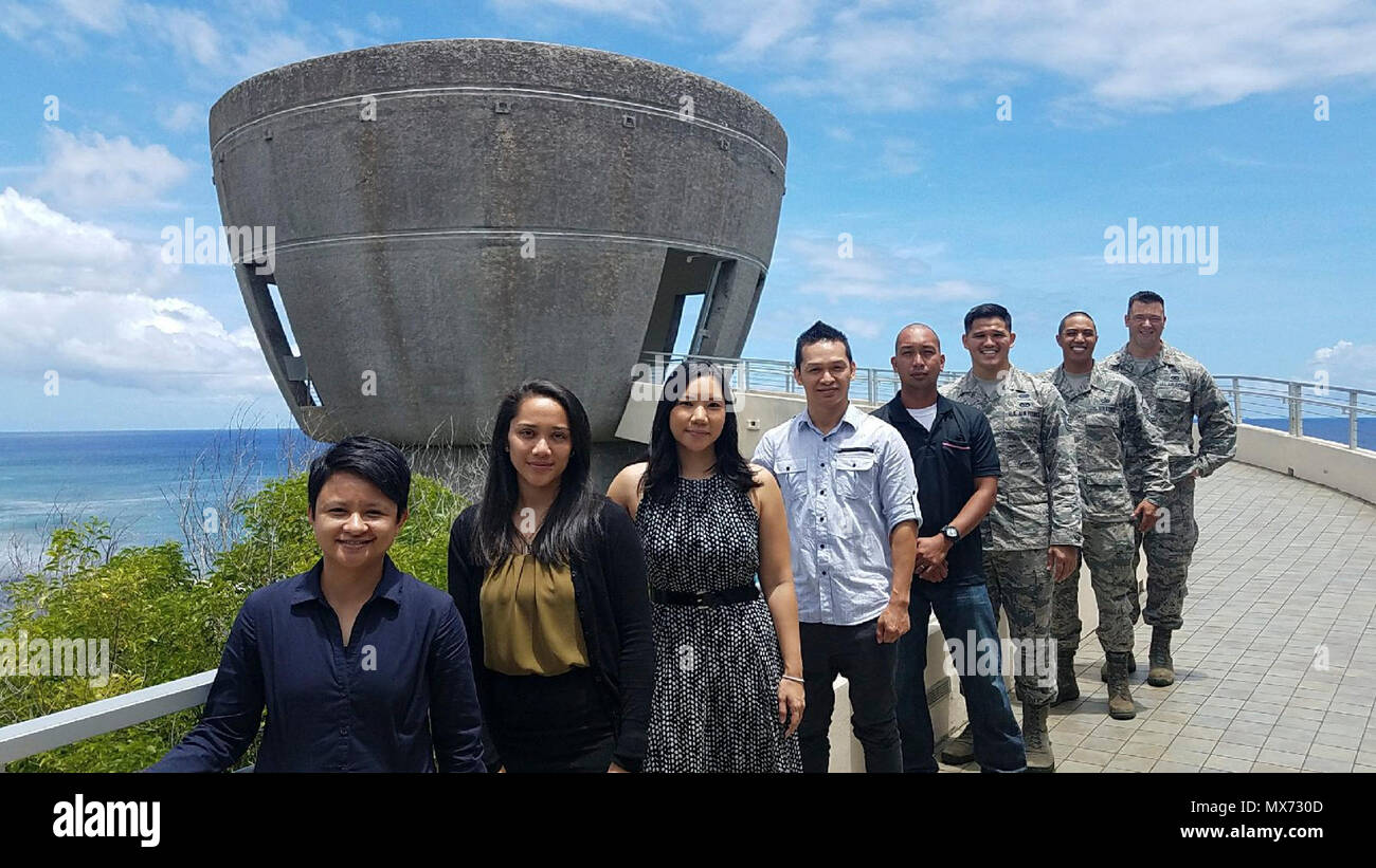 Five recruits joining the Air Force Reserve recited the oath of the enlistment at the world’s largest Latte Stone, the Latte of Freedom monument, Hagatna, Guam, April 29, 2017. From left to right: Senior Airmen Jamie Mantanane, Tara Mantanona, Yvonne Manglona, Chrisaldy Manalese, Staff Sgt. Vincent Olinger, Tech. Sgt. Michael Shinohara, line recruiter, Master Sgt. Vincent Cabrera, 44th Aerial Port Squadron superintendent, Maj. Cliff Harris, 624th Regional Support Group deputy commander. The Latte of Freedom is a giant latte stone standing at 80 feet tall with walls 14 feet thick overlooking th Stock Photo