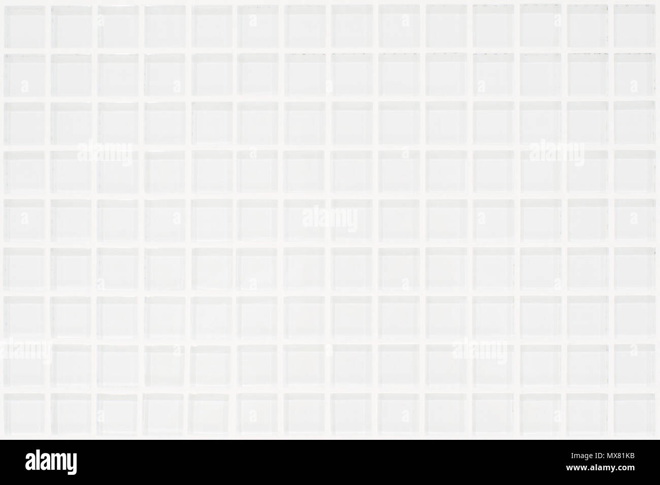 White glassy tile with squares in rectangular form with white joints Stock Photo