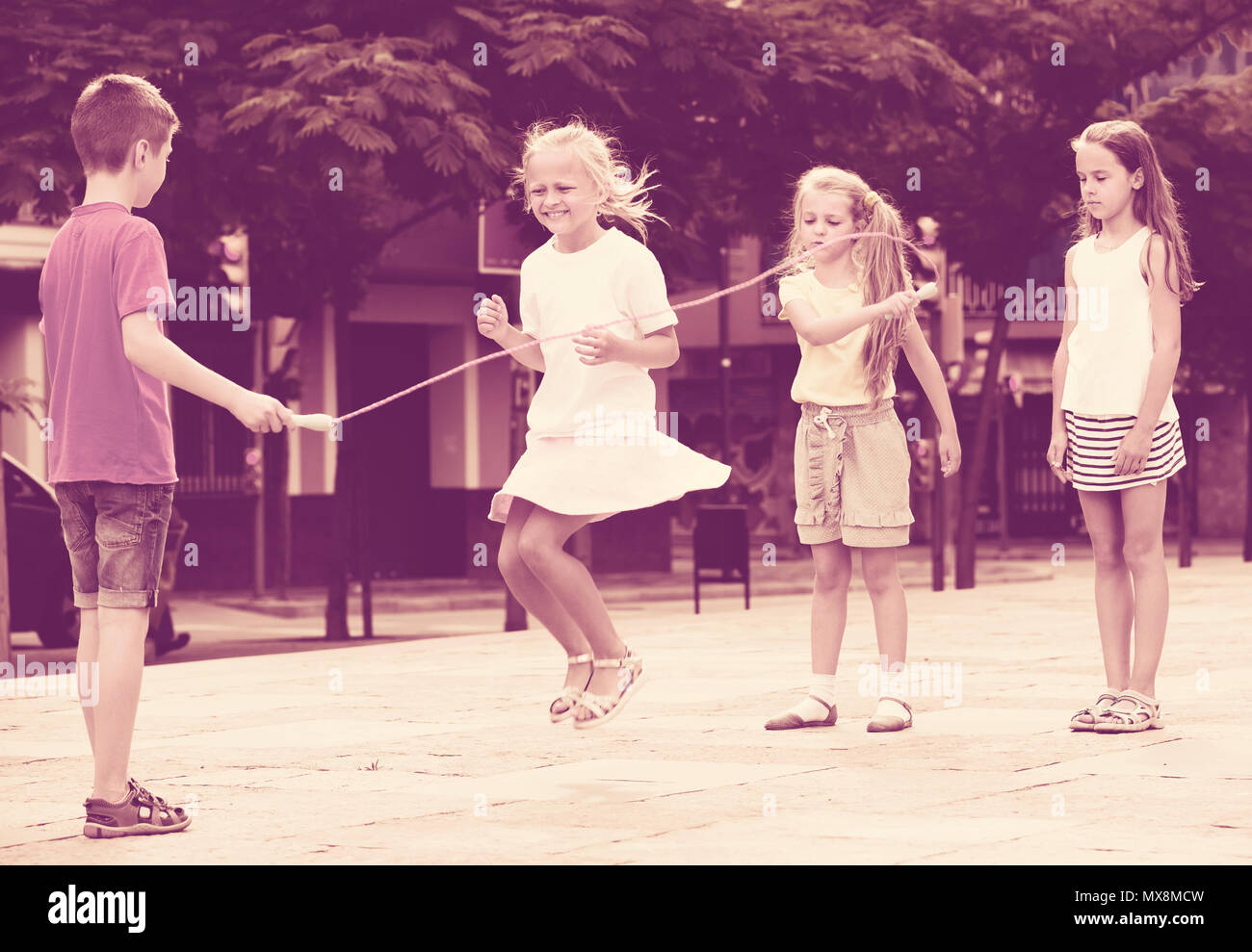 Portrait four happy friends jumping hi-res stock photography and images ...