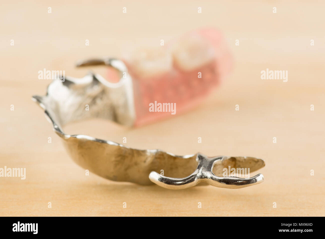 large image of a modern denture on a wooden background Stock Photo