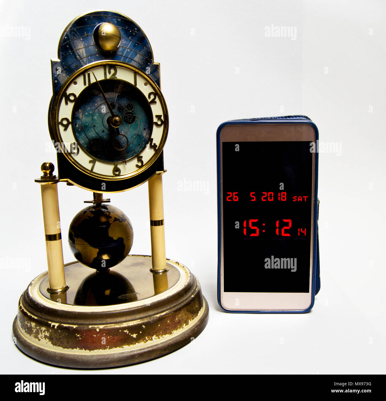 evolution of time measurement from historical clock to modern smartphone. Stock Photo