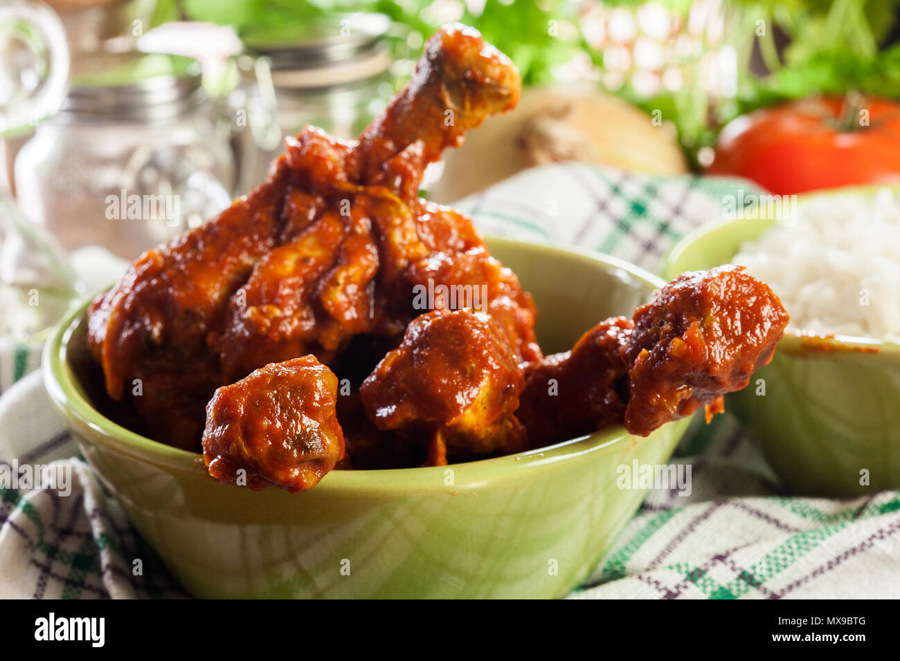 Chicken drumsticks curry with rice served in a bowl Stock Photo Alamy