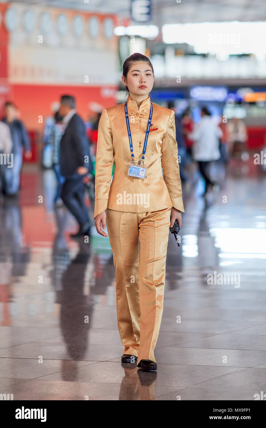 BEIJING-SEPT. 27, 2010. Charming hostess at Beijing Capital International Airport, the main hub for Air China, the flag carrier of China. Stock Photo