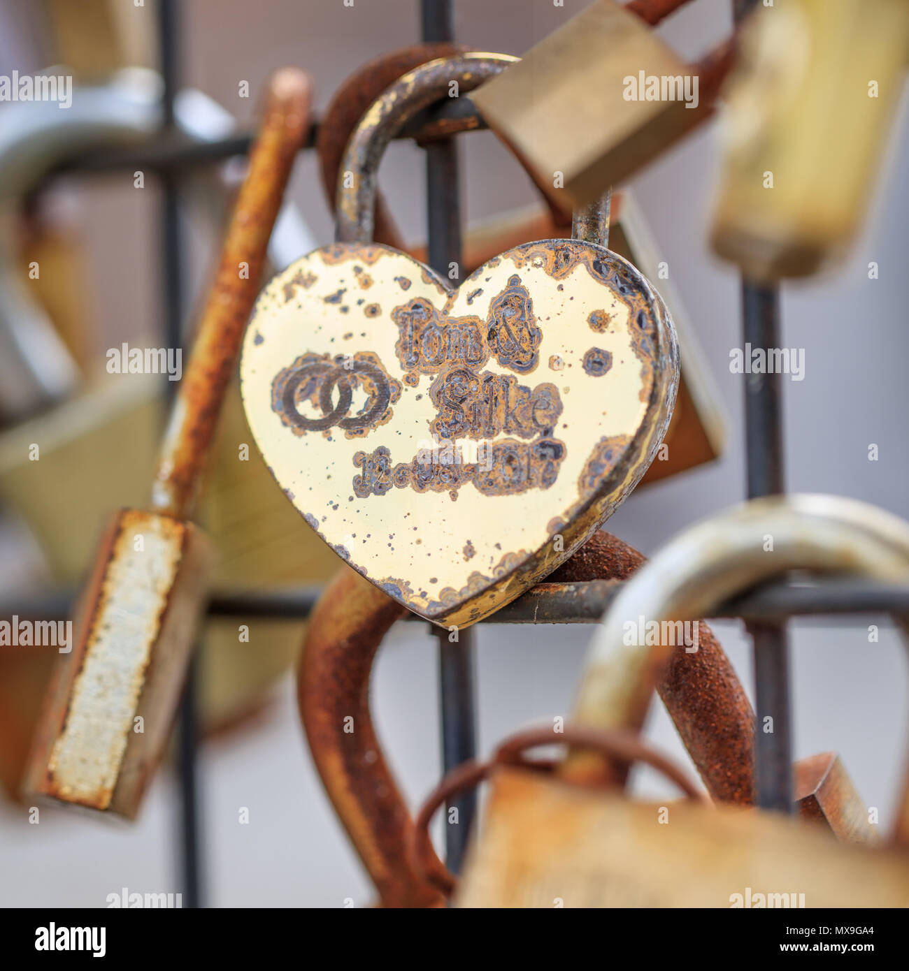 ANTWERP-MAY 21, 2018. Close up of a padlock in the lock love wall in Antwerp center. Love lock walls is a trend in cities all over the world. Stock Photo