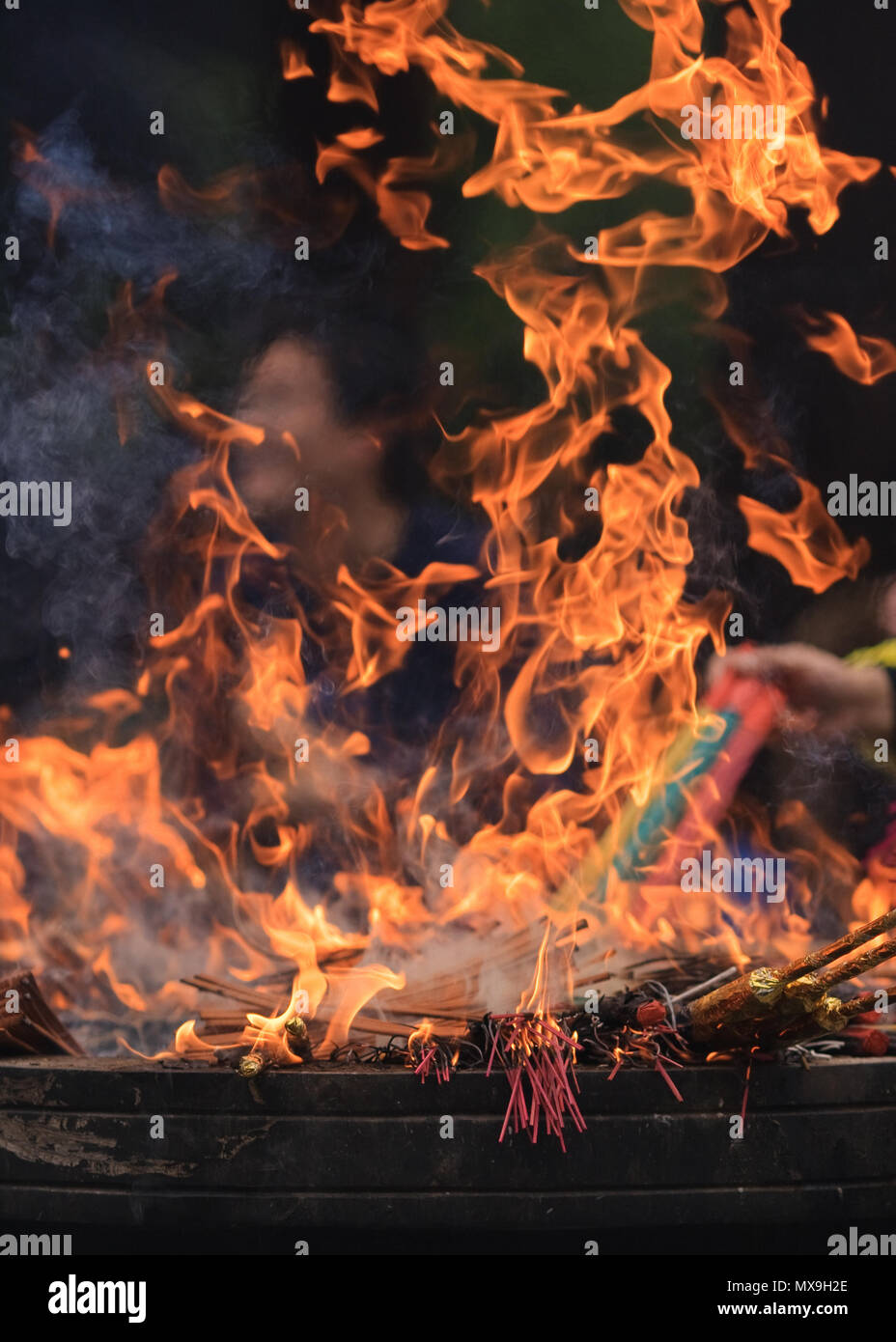 Flames of burning incense in an altar of a Buddhist temple, Hangzhou