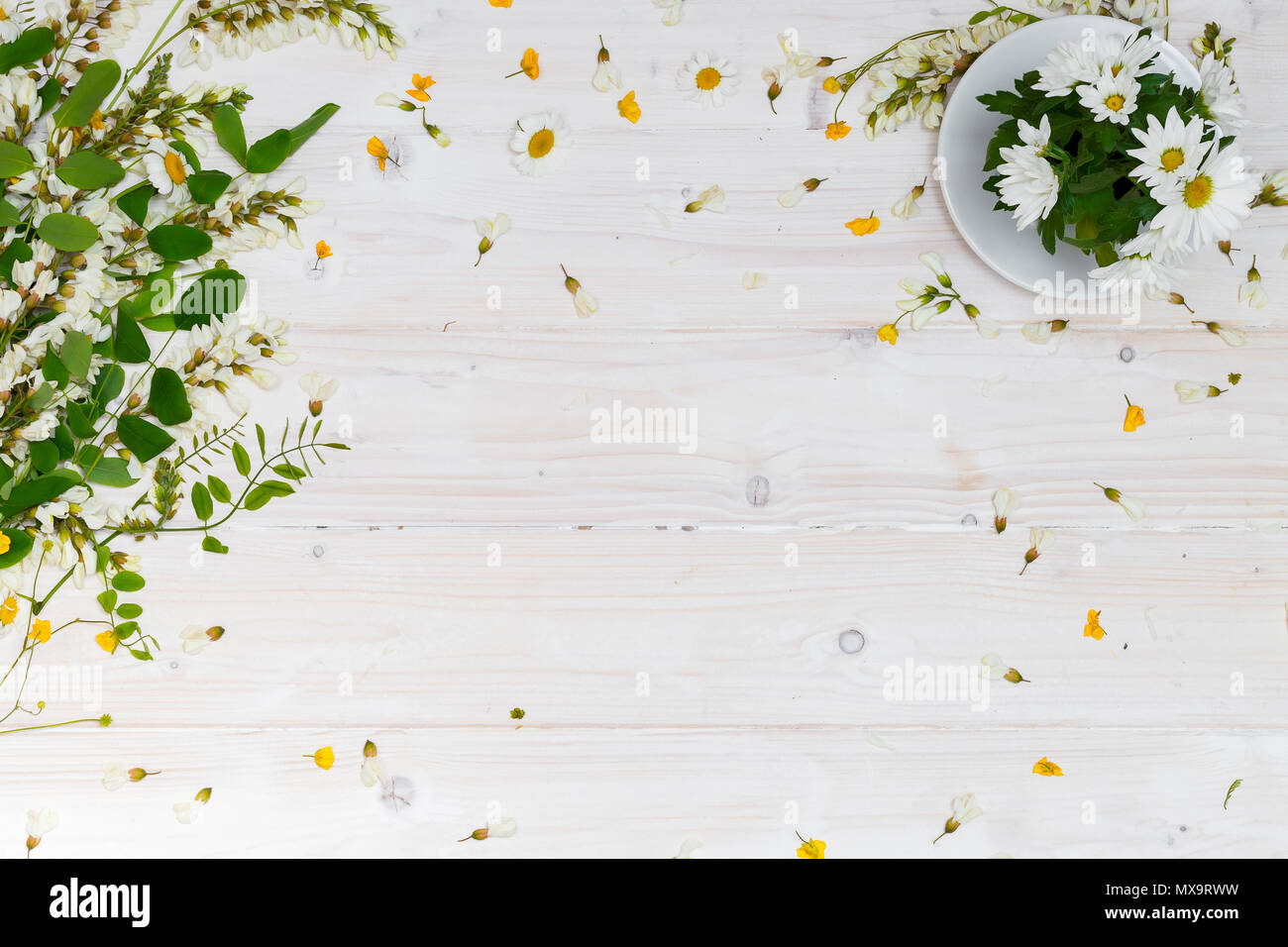 Blank white tabletop with spring flowers Stock Photo