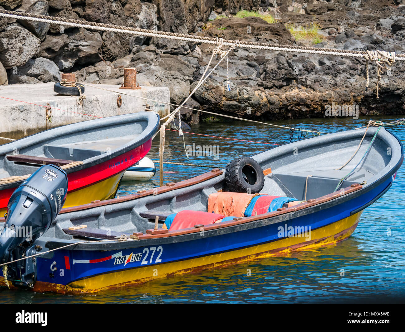 Colourful small boats tied up in harbour, Hanga Roa, Easter Island, Rapa Nui, Chile Stock Photo