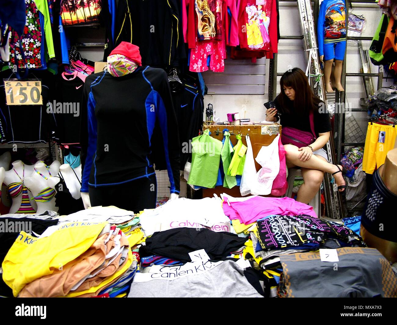 DIVISORIA, MANILA CITY, PHILIPPINES - MAY 14, 2018: Assorted clothes on display at a bazaar stall inside a big shopping mall. Stock Photo