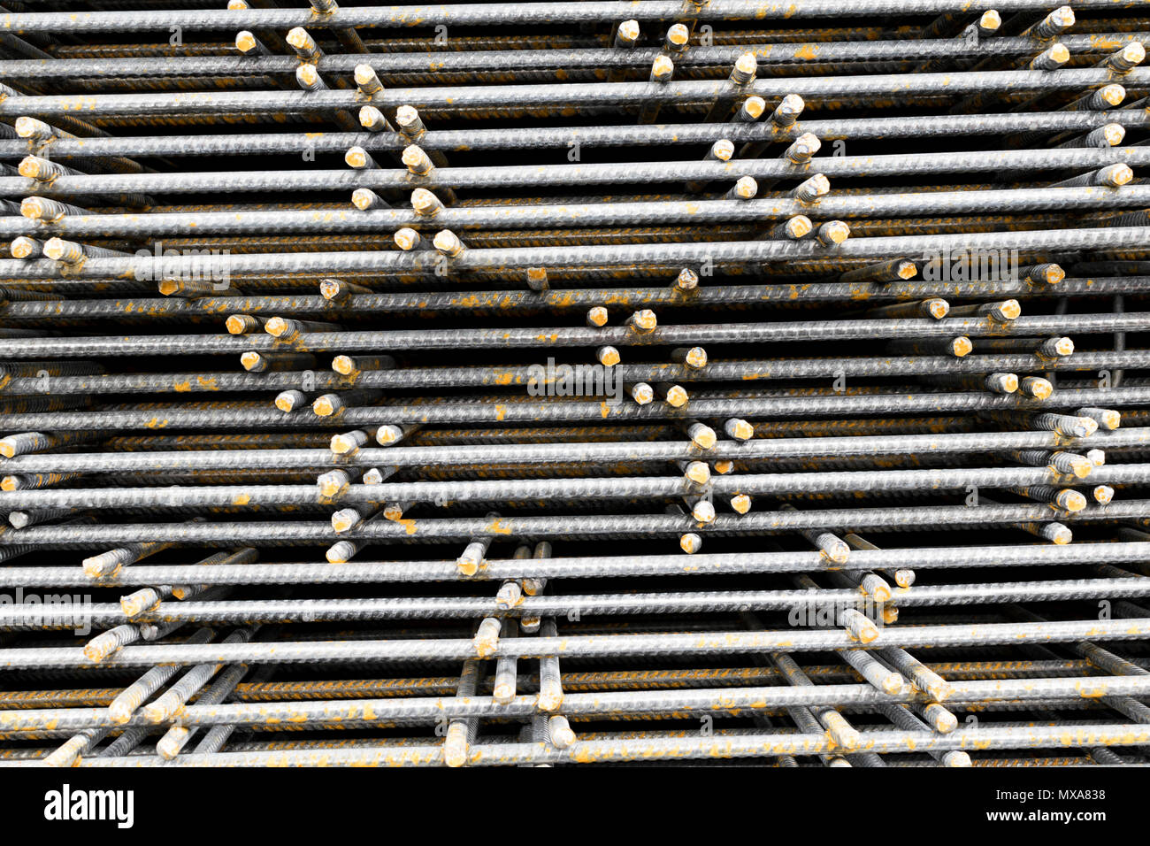 Close-up of a stack of hot-rolled round steel reinforcing bars (Rebars) laid flat Stock Photo