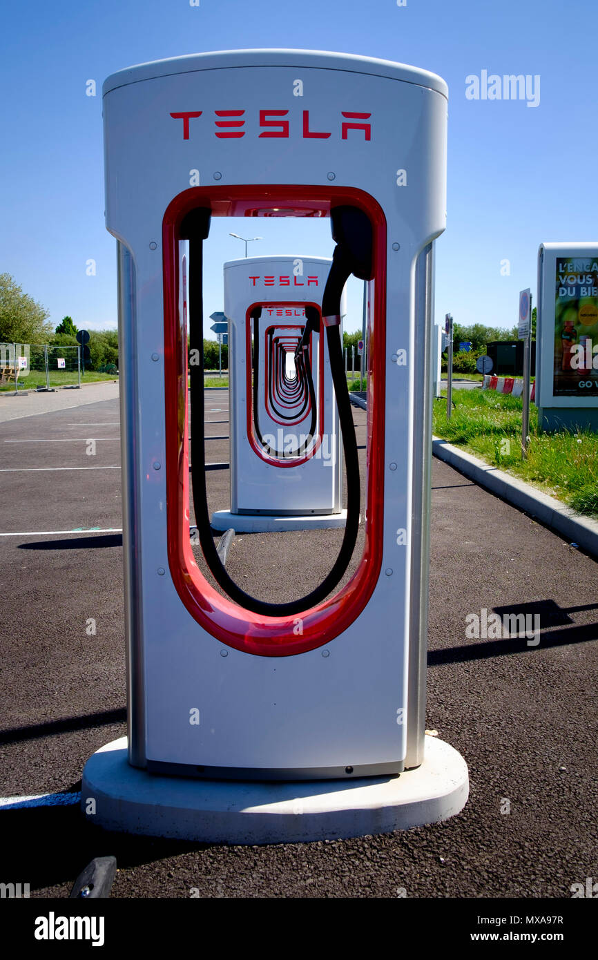 Tesla multi electric car charging points at French service station Stock Photo