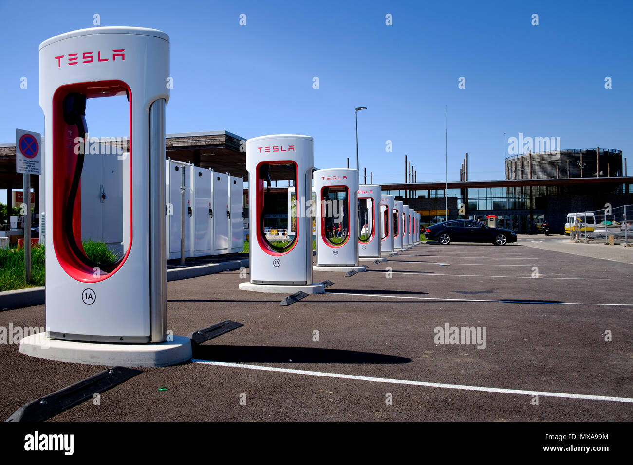 Tesla multi electric car charging points at French service station Stock Photo