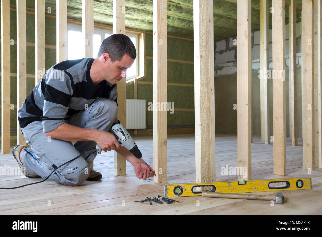 Interior Of Attic Insulated Room With Oak Floor Under