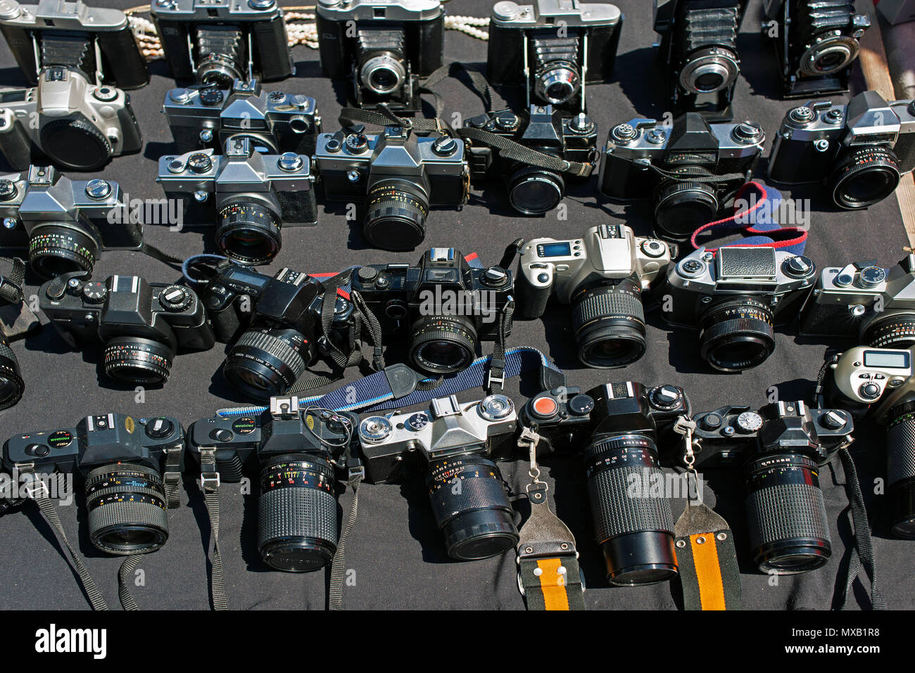 Lots of vintage cameras in a flea market Stock Photo Alamy